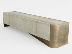 a concrete bench sitting on top of a white floor