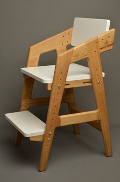 a wooden chair with two white seats on it