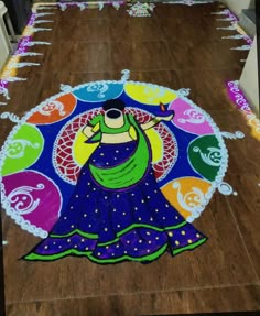 this is an image of a woman on the floor in front of a decorated table