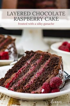 a slice of layered chocolate raspberry cake on a plate