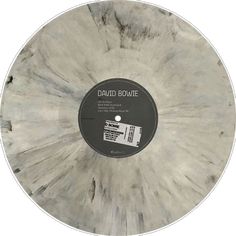 a white and black disc with the words david bovine on it