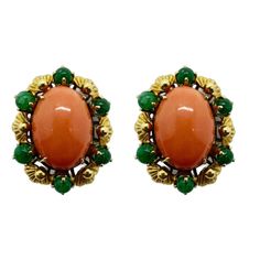 Elevate your jewelry collection with these stunning 18k Yellow Gold Cabochon Orange Stone and Emerald Earrings. Crafted from 18k yellow gold, these earrings feature a beautiful cabochon orange stone and approximately 2.50 carats of emeralds. With a length of 1 inch, they are perfect for any occasion. Add a touch of vintage glamour to your look with these 1960's earrings. "18k" markings assure quality and the lightweight of 21.7 grams creates comfortable wear. 18k Yellow Gold Cabochon Orange Ston 1960s Earrings, Glamour Vintage, Orange Stone, Emerald Earrings, Vintage Glamour, Shop Earrings, 1 Inch, Etsy Earrings, Jewelry Collection