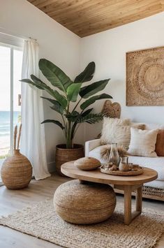 a living room filled with furniture and a large plant on top of a wooden table