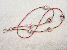 *Turn your badge into a piece of jewelry with this beautifully handcrafted lanyard* PRODUCT STYLE:     Holiday (Green) DESCRIPTION: This is a fun holiday lanyard with glass red peppermint and green beads adorn with seed beads,and silver spacers. Length is 32" long but hangs down 17" not including the badge ID. Smart Jewelry, Beaded Lanyards, Green Beads, Raleigh Nc, Id Holder, Green Bead, Holiday Fun, Peppermint, Lanyard