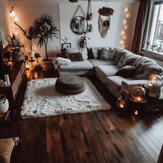 a living room filled with furniture and lots of lights on the wall above it's windows