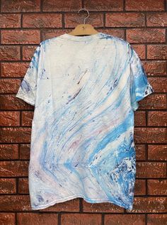 Vintage 90s Tie Dye Marble Art Hippie T Shirt / Skates Surfing T Shirt / 90s Vibe / 90s Streetwear T Shirt Size L Condition : Good Used Size on tag : LColour : Marble art tie dyeBrand : UnknownMeasurement : Armpit to armpit - 21.5”Length - 29.5”Material : CottonMade In: USA THE SHIPPING (Your Choice Please read)1. The shipping cost is USD 20 via Malaysian Registered Postage With Tracking Number.It will take 2-4 weeks or more for delivery, depends on your custom checking.2. Add USD 10 for speedy Blue Graffiti Print T-shirt For Summer, Artsy Cotton Crew Neck T-shirt, Blue Relaxed Fit T-shirt With Graffiti Print, Short Sleeve Graphic Tee With Abstract Print, Casual Short Sleeve T-shirt With Abstract Print, Blue Graffiti Print Crew Neck T-shirt, Blue Crew Neck T-shirt With Graffiti Print, Cotton T-shirt With Abstract Print In Relaxed Fit, Cotton Graphic Tee With Abstract Print