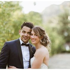 a bride and groom posing for a photo