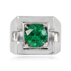 A vintage French emerald ring featuring a 2.01 carat round cut natural emerald, set in prongs inside a square bezel. The mounting is 18k white gold, with geometric cut-outs on the shoulders. This ring was handcrafted during the Retro era, circa 1940, and bears French hallmarks.
The measurements of the emerald are approximately 8.45mm x 8.50mm x 5.11mm. The measurements of this ring are approximately 14.37mm x 14.45mm.
This ring can be resized at no extra cost.
If you have any questions about the Estate Diamond Jewelry, Emerald Set, Retro Era, Retro Ring, Natural Emerald, Emerald Ring, Vintage French, Cut Outs, French Vintage