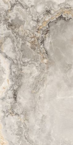 an abstract marble pattern with gold and grey colors is shown in this image, it appears to be made from natural materials