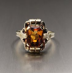 Beautiful 1950s vintage silver citrine ring, US Size 7 1/2, in good vintage condition. Box on the photos not included! Diameter: approx. 20 mm (0.7 inch) Material: silver, citrine total weight: 3 g US Size: approx. 7 1/2 (EU size 56) A stunning religious shop well worth a visit ... https://etsy.me/2NNNK4g Vintage Formal Birthstone Jewelry, Brown Hallmarked Vintage Ring, Vintage Brown Hallmarked Ring, Vintage Citrine Yellow Gold Jewelry, Vintage Yellow Gold Citrine Jewelry, Vintage Citrine Gemstone Jewelry, Antique Brown Rings For Anniversary, Vintage Yellow Citrine Jewelry, Vintage Brown Hallmarked Jewelry