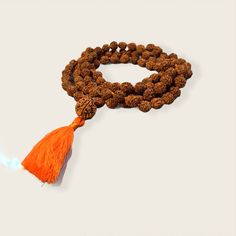 Rudraksha Mala necklace 10mm with 15mm guru bead. Hand Knotted with a cotton tassel. Hindu mala for meditation or chanting. Adjustable Hand Knotted Mala For Meditation, Holistic Hand-strung Mala For Meditation, Hand-strung Spiritual Mala For Meditation, Spiritual Hand-strung Mala For Meditation, Spiritual Brown Mala For Meditation, Brown Spiritual Mala For Meditation, Holistic Necklaces With 8mm Beads For Festivals, Holistic Necklaces With 8mm Beads For Rituals, Adjustable Holistic Mala For Meditation