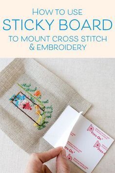 a person is holding up a cross - stitch pattern on a piece of fabric with the words, how to use sticky board to mount cross stitch and embroidery