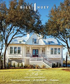 the front cover of a magazine with an image of a white house and two trees