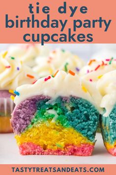 rainbow cupcakes with white frosting and sprinkles on the inside