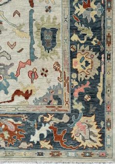 The rug features a serene palette of midnight blue, accented by contrasting shades of ivory, sage green, coral pink, and charcoal black. This exquisite hand-knotted Oushak wool rug is a masterpiece of Turkish craftsmanship, renowned for its intricate designs and luxurious texture. The rug's field is dominated by a calming midnight blue hue, reminiscent of a moonlit garden, creating a serene and inviting atmosphere. The intricate floral and geometric motifs, meticulously woven with wool of varyin Rug Dining Room, Custom Area Rugs, Living Room Area Rugs, Dining Room Rug, Floral Rug, Geometric Rug, Bedroom Rug, Blue Rug, Repeating Patterns