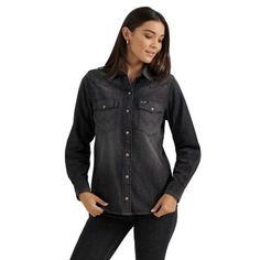 Down to the smallest detail, our Women's Wrangler Retro Denim Slim Cowboy Snap Shirt is a true classic. It's cut from lightweight denim made of 100% cotton for lasting comfort and quality. Vintage-inspired with a slimmer cut than our most popular denim shirt, its one-point yokes, chest pockets with flaps, "W" pocket stitching, and pearl snaps will deliver the Western authenticity every outfit needs. Worn alone or layered, it'll always be a favorite. Slim FIt Western Front & Back Yokes Snap Buttons Long Sleeve Classic "W" Stitching 100% Cotton Womens Wrangler Shirts Long Sleeve, Black Denim Shirt, Denim Cowboy, Denim Western Shirt, Pocket Stitching, Western Denim Shirt, Cowboy Shirt, Western Front, Wrangler Shirts