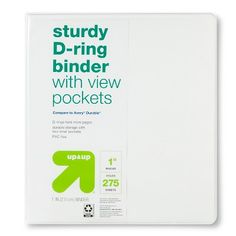 a white binder with green letters on it