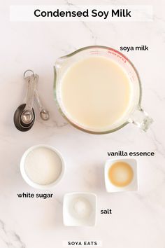 ingredients to make homemade soy milk on a white marble counter top with text overlay