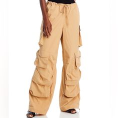 Never Worn Spring Utility Full Length Parachute Pants, Utility Wide Leg Parachute Pants For Spring, Spring Utility Wide Leg Parachute Pants, Spring Wide-leg Parachute Pants With Cargo Pockets, Spring Utility Pants Full Length, Full-length Pants With Multiple Pockets For Spring, Spring Pants With Multiple Pockets, Utility Full-length Pants For Spring, Spring Utility Full Length Pants