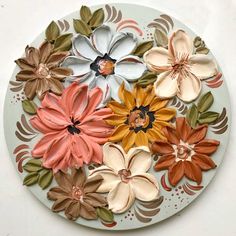 a white plate with flowers painted on it