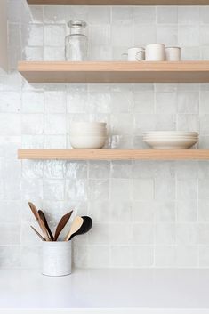 the kitchen counter is clean and ready to be used for cooking or baking, as well as utensils