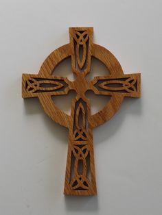 a wooden cross with an intricate design on it