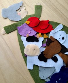 there are many felt animals on the table