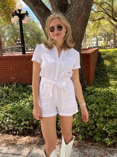 Get ready for summer with the Hayden Linen Romper! Made of a cool & breathable linen, this romper is the perfect travel companion for all your adventures. Say hello to summer in style and comfort with this must-have piece! White Linen Romper Elastic Waistband Front Button Closures with Matching Tie Belt Collared Neckline with Cuffed Hems Pockets!! Styled with Zoey Sunnies and cowboy boots! SIZING: Runs true to size! Mary Kate is wearing a size small, she typically wears a 4/Small in most items & White Casual Beach Jumpsuits And Rompers, Summer Jumpsuits And Rompers With Short Sleeves Relaxed Fit, White Casual Jumpsuits And Rompers For Beach, Casual White Jumpsuits And Rompers For The Beach, Casual Short Sleeve Jumpsuits And Rompers For Vacation, Summer Linen Jumpsuits And Rompers In Relaxed Fit, Summer Linen Jumpsuits And Rompers With Relaxed Fit, White Vacation Jumpsuits And Rompers With Pockets, White Beach Jumpsuit With Relaxed Fit