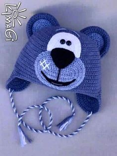 a crocheted hat with a bear on it