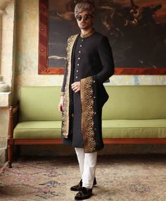 <p><strong>Sherwani:</strong><br />Color: Black<br />Fabric: Jamawar<br />Sherwani features rich quality embellishments accent the on collar and sleeves<br />Fanciful front button closure</p> <p><strong>Inner:</strong><br />Comes with off-white kurta and pajama<br /><br /><strong>Additional Accessories:<br />Tied pre-made Turban: </strong>US$150<strong><br /></strong><strong>Mens Embroidered Shawl (subject to the availablity) As shown: </strong>US$200<strong><br /></strong><strong>Jodhpuri/Salee Designer Embroidered Bandhgala With Straight Kurta, Designer Embroidered Kurta For Diwali, Designer Kurta With Intricate Embroidery For Festive Occasions, Designer Straight Kurta With Resham Embroidery, Designer Festive Kurta With Intricate Embroidery, Festive Traditional Wear With Long Sleeves, Designer Long Sleeve Sherwani For Festive Occasion, Designer Resham Embroidery Straight Kurta, Designer Sets With Resham Embroidery And Long Sleeve