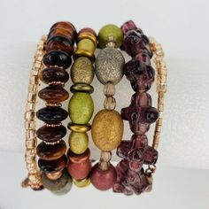 Brown Earth Tone Wrap Stack Bracelet Lava Stone Jasper Copper Tone Boho Brown Beaded Bracelets Perfect For Gifts, Elegant Multicolor Hand Wrapped Wrap Bracelet, Elegant Multicolor Bracelets For Beach, Elegant Multicolor Bracelet For Beach, Earth Tone Bracelets, Multicolor Stackable Wrap Bracelet, Colorful Beads Multi-strand Bracelet, Brown Gemstone Bracelets, Multicolor Multi-strand Bracelets