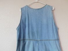 "1970's light blue sleeveless denim long dress Floral embroidery - front neckline, two loops and two pockets Back side splits and center - right split worn Two button on back at center Vintage signs as noted above. Otherwise, in great condition Dimension - shoulder 15\" bust 20.5\" length 50\" side split 10\" center split 9.5\"" Light Wash Vintage Dresses For Spring, Vintage Sleeveless Denim Dress For Summer, Vintage Light Wash Dresses For Spring, Retro Sleeveless Denim Dress For Spring, Retro Sleeveless Denim Dress For Summer, Summer Retro Sleeveless Denim Dress, Vintage Light Wash Summer Dress, Summer Vintage Light Wash Dress, Retro Sleeveless Cotton Denim Dress