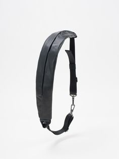 A luxury leather update of the zippered ADDA shoulder strap, this piece can be worn on its own, either as a minimal crossbody bag or around the waist. Using the matt metal carabiner clips on the black webbing straps, the ADDA can be attached to other côte&ciel products as an additional accessory, functioning as a carrying strap or extra storage compartment on bags. Black Detachable Bag Strap Fashion Accessory, Modern Bag Strap With Detachable Feature For On-the-go, Black Detachable Bag Strap, Detachable Leather Bag Strap For On-the-go, Black Chest Bag With Adjustable Strap For On-the-go, Extra Storage, Crossbody Bag, Shoulder Strap, Leather