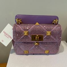 Small Valentino Garavani Bag Shoulder/ Crossbody. New With Tags And No Dustbag. Color I Mentioned Purple But It’s A Lighter Purple As Shown In The Video And Pics. Designer Evening Tote Bag With Detachable Strap, Designer Evening Bag With Detachable Strap For Shopping, Luxury Top Handle Evening Bag With Dust Bag, Designer Satchel Bags For Evening, Designer Top Handle Evening Bag, High-end Pink Shoulder Bag For Evening, Designer Evening Bags With Detachable Strap, Designer Evening Box Bag, Luxury Purple Rectangular Bag