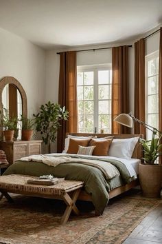 a bed room with a neatly made bed and lots of plants on the windowsill