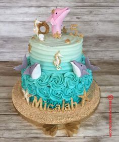 a birthday cake decorated with sea animals and the number 5 on it's side