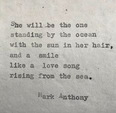 an old typewriter with the words she will be the one standing by the ocean with the sun in her hair and a smile like a love song rising from the sea