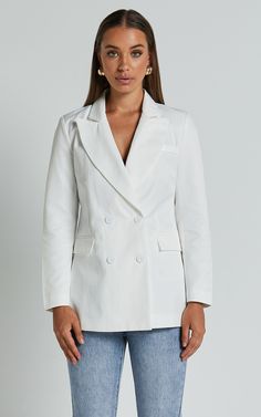 Elevate your outfit with the Harriet Blazer. This linen blend double breasted oversized blazer in white is the perfect addition to any wardrobe. With its casual yet stylish design, this jacket can effortlessly take you from a day at the office to a night out with friends. The long sleeves and standard fit provide comfort and versatility, allowing you to create endless looks. Made from high-quality linen fabric, this blazer not only looks great but feels great too. Whether you pair it with jeans White Tailored Double-breasted Blazer, White Double-breasted Blazer With Double Button Closure, White Double-breasted Notch Lapel Outerwear, White Double-breasted Long Sleeve Blazer, White Linen Blazer With Notch Lapel, White Linen Outerwear With Notch Lapel, White Linen Notch Lapel Outerwear, White Linen Blazer With Lapel Collar, Chic Linen Blazer With Double Button Closure