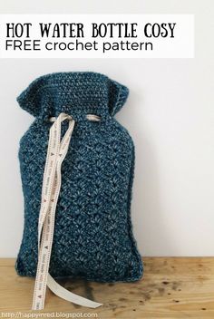 a crocheted bag with a measuring tape attached to it and the text hot water bottle cosy free crochet pattern