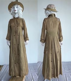 1880-1890. Summer women's duster coat. Fabric: rye-colored linen. Double-breasted, two rows of buttons in front. Large cuffs with 3 buttons. Worn on a dress with a bustle. Interesting 2 pockets on the side almost at the back, very interesting. Long coat. But it has many flaws. One sleeve has cracks (Diderot on video) they are carefully darned. It cracked under the shoulder + one at the waist under the button. And 2-3 more small ones. Definitely can't be worn. But it looks very good at the exhibition. . Waist: 14.5 inches (in horizontal position).  Length from shoulder 53.5 inches Brown Linen Outerwear With Buttons, Womens Duster Coat, Upcycled Duster Coat, Duluth Flannel Duster, Western Spring Duster, Wool Duster, Woman’s Duster Coat, Long Duster, Women's Costumes