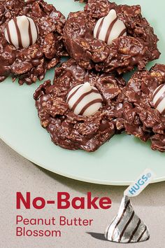 no bake peanut butter blossom cookies on a green plate with a candy bar in the middle