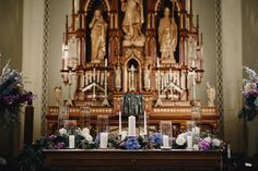 the altar is decorated with flowers and candles