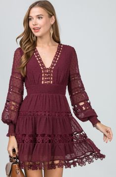 Nothing says romance like the Felicity Burgundy Long Sleeve Flare Mini Dress! Swiss dot fabric forms this lovely burgundy dress with altering crochet floral lace details. Features a plunging V-neckline, fitted button-down bodice, long blouson sleeves with smocked cuffs. Empire waist falls into an attached tiered flared mini skirt. Back hidden zipper/clasp closure. Partially lined. V-neck Lace Bodice Dress For Date Night, Scalloped Lace V-neck Dress For Brunch, Lace Bodice Mini Dress For Date Night In Spring, Feminine Long Sleeve Dress With Lace Bodice, Long Sleeve Lace Dress For Brunch, V-neck Lace Patchwork Dress For Date Night, Long Sleeve Lace Dress With Patchwork For Brunch, Chic V-neck Dress With Lace Bodice, Feminine V-neck Mini Dress With Lace Patchwork