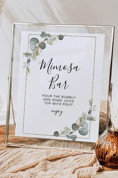 a sign that says minnesota bar on it next to a vase with feathers in it