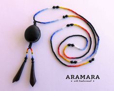 "Length: 16 inches (40.64 cm) Diameter of the seed is 1 inch (2.54 cms) This necklace is all handmade with a natural seed of ojo de venado (deer's eye) and hollowed thorns of the tree Acacia Cornigera or \"Jarretaderas\". In many cultures, they can be used as a good luck charms. The Ojo de Venado or Deer's Eye charm, from the tree Mucuna pruriens, is a Mexican form of magical protection agaisnt the evil eye. Like many other apotropaic charms of this sort, it is itself an eye. The Huichol represe Handmade Adjustable Beaded Necklace With Teardrop Pendant, Adjustable Teardrop Necklace With Colorful Beads, Handmade Adjustable Teardrop Pendant Beaded Necklaces, Handmade Adjustable Teardrop Pendant Beaded Necklace, Adjustable Multicolor Teardrop Necklace, Artisan Teardrop Beaded Necklaces As Gifts, Artisan Teardrop Beaded Necklaces For Gifts, Teardrop Black Beads Jewelry As Gift, Teardrop Black Bead Jewelry Gift