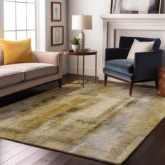 a living room with two couches and a rug on the floor in front of a fireplace