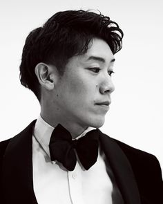 a young man wearing a tuxedo and bow tie