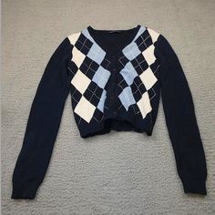 This Is A Brandy Melville Cardigan/Sweater. It Has A Blue White And Navy Argyle Design. I've Only Worn This Once To A Birthday Party But Other Than That Is It Unused. Trendy Navy Sweater For Fall, Preppy Long Sleeve Fall Sweater, Trendy Navy Sweater For Winter, Preppy Cotton Winter Tops, Preppy Black Top For Fall, Preppy Cotton Tops For Winter, Preppy Long Sleeve Cotton Sweater, Preppy Crew Neck Sweater For Fall, Preppy Long Sleeve Fitted Sweater