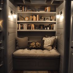 a room that has some books on the shelves and a bench in front of it