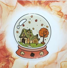 there is a snow globe with a house in it and trees inside the glass ball